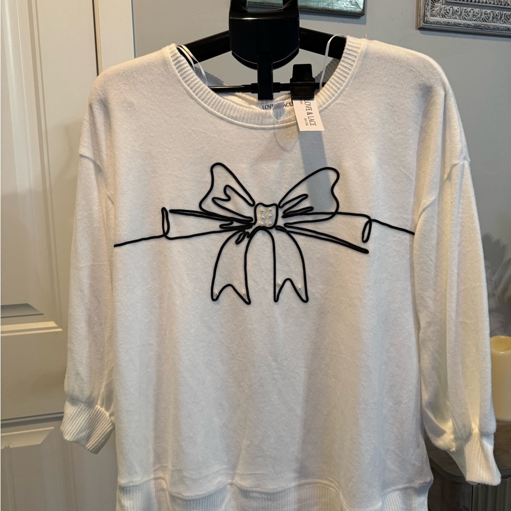 White Sweater with Black Bow Design